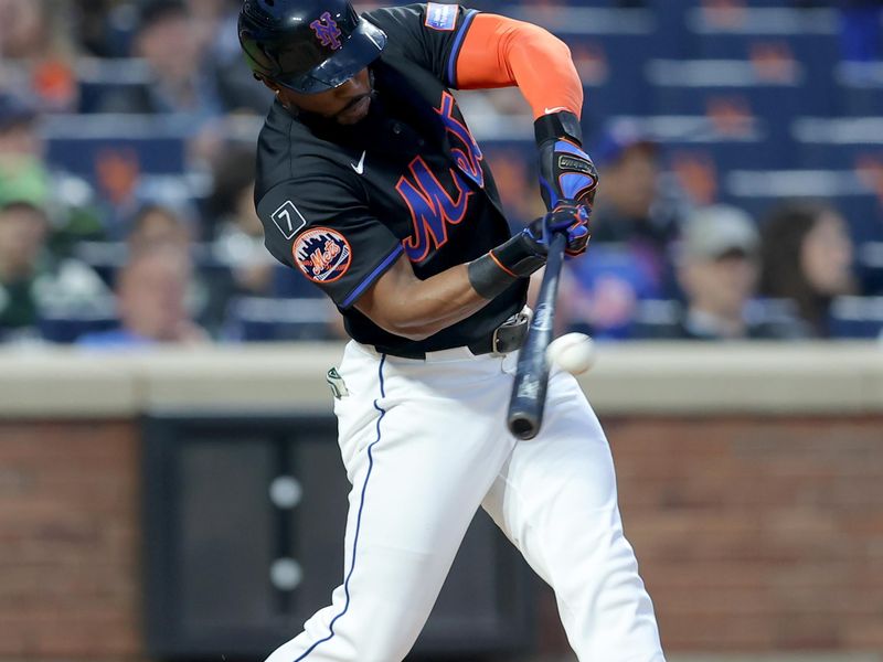 May 30, 2025; New York City, New York, USA; New York Mets designated hitter Starling Marte (6) hits a solo home run against the Colorado Rockies during the fourth inning at Citi Field. Mandatory Credit: Brad Penner-Imagn Images