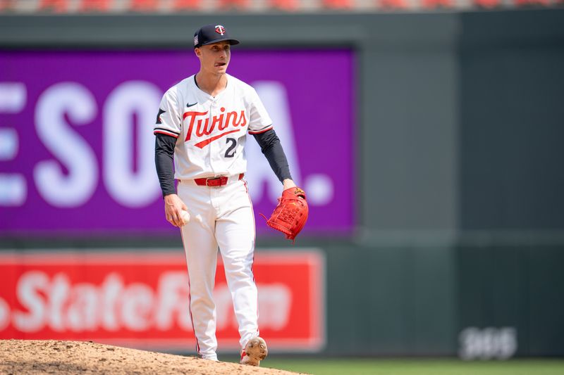 Jul 21, 2024; Minneapolis, Minnesota, USA; Minnesota Twins pitcher Griffin Jax (22) awaits the umpire review of a two-run home run hit off him in the eithth inning at Target Field. Mandatory Credit: Matt Blewett-USA TODAY Sports