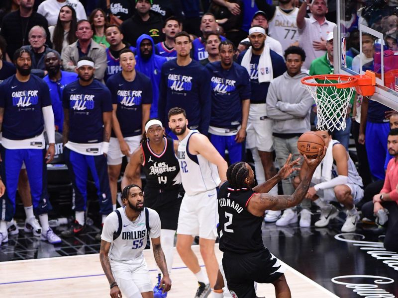 LOS ANGELES, CA - APRIL 23: Kawhi Leonard #2 of the LA Clippers goes to the basket during the game  against the Dallas Mavericks during Round 1 Game 2 of the 2024 NBA Playoffs on April 23, 2024 at Crypto.Com Arena in Los Angeles, California. NOTE TO USER: User expressly acknowledges and agrees that, by downloading and/or using this Photograph, user is consenting to the terms and conditions of the Getty Images License Agreement. Mandatory Copyright Notice: Copyright 2024 NBAE (Photo by Adam Pantozzi/NBAE via Getty Images)