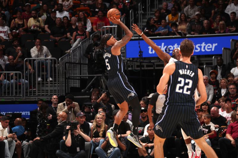 MIAMI, FL - OCTOBER 23: Paolo Banchero #5 of the Orlando Magic shoots the ball during the game against the Miami Heat on October 23, 2024 at Kaseya Center in Miami, Florida. NOTE TO USER: User expressly acknowledges and agrees that, by downloading and or using this Photograph, user is consenting to the terms and conditions of the Getty Images License Agreement. Mandatory Copyright Notice: Copyright 2024 NBAE (Photo by Issac Baldizon/NBAE via Getty Images)