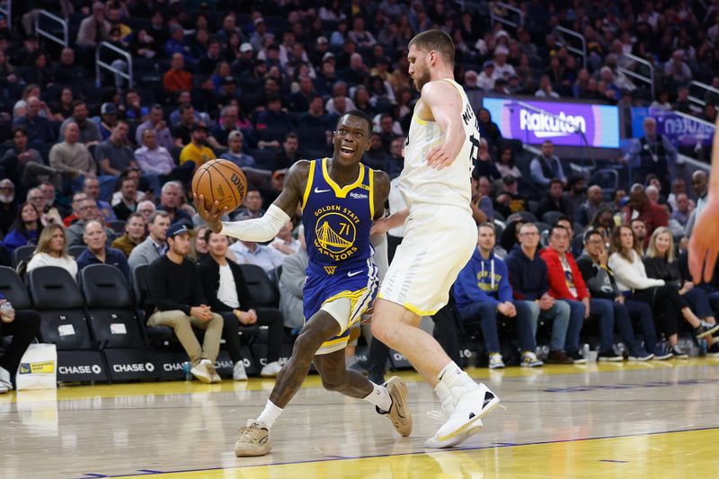 SAN FRANCISCO, CALIFORNIA - JANUARY 28: Dennis Schroder #71 of the Golden State Warriors goes to the basket against Svi Mykhailiuk #19 of the Utah Jazz in the second quarter at Chase Center on January 28, 2025 in San Francisco, California. NOTE TO USER: User expressly acknowledges and agrees that, by downloading and or using this photograph, User is consenting to the terms and conditions of the Getty Images License Agreement. (Photo by Lachlan Cunningham/Getty Images)