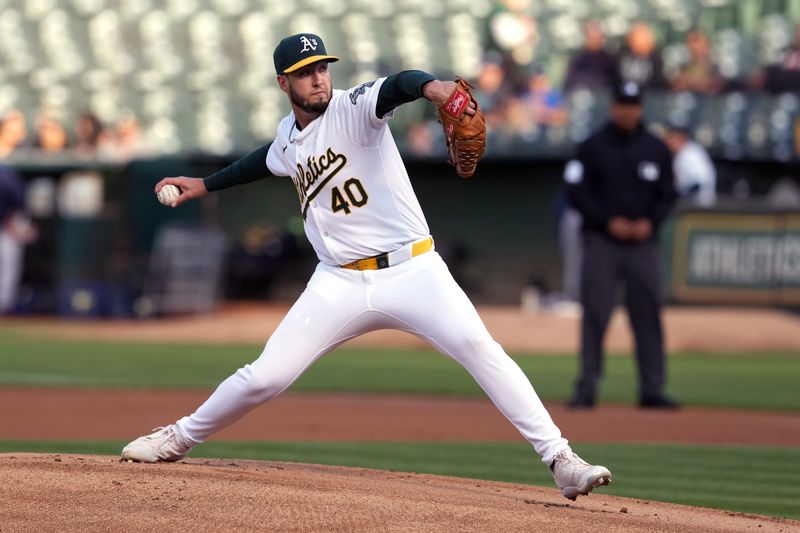 Aug 21, 2024; Oakland, California, USA; Oakland Athletics starting pitcher Mitch Spence (40) throws a pitch against the Tampa Bay Rays during the first inning at Oakland-Alameda County Coliseum. Mandatory Credit: Darren Yamashita-USA TODAY Sports