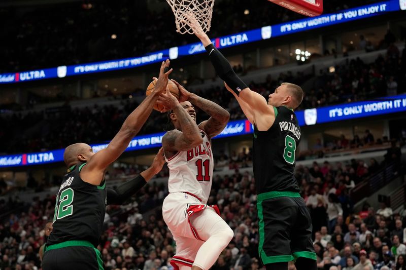 CHICAGO, ILLINOIS - FEBRUARY 22: DeMar DeRozan #11 of the Chicago Bulls shoots the ball against Al Horford #42 and Kristaps Porzingis #8 of the Boston Celtics during the second half at the United Center on February 22, 2024 in Chicago, Illinois. NOTE TO USER: User expressly acknowledges and agrees that, by downloading and or using this photograph, User is consenting to the terms and conditions of the Getty Images License Agreement. (Photo by Patrick McDermott/Getty Images)