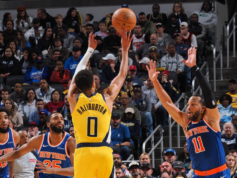 INDIANAPOLIS, IN - NOVEMBER 10: Tyrese Haliburton #0 of the Indiana Pacers shoots a three point basket during the game against the New York Knicks  during a regular season game on November 10, 2024 at Gainbridge Fieldhouse in Indianapolis, Indiana. NOTE TO USER: User expressly acknowledges and agrees that, by downloading and or using this Photograph, user is consenting to the terms and conditions of the Getty Images License Agreement. Mandatory Copyright Notice: Copyright 2024 NBAE (Photo by Ron Hoskins/NBAE via Getty Images)