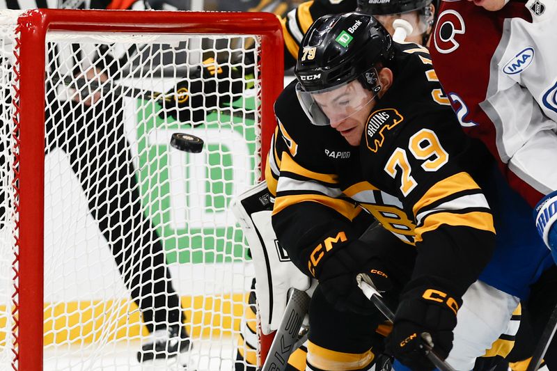 Oct 25, 2025; Boston, Massachusetts, USA; A loose puck goes through the crease next to Boston Bruins defenseman Michael Callahan (79) during the first period against the Colorado Avalanche at TD Garden. Mandatory Credit: Winslow Townson-Imagn Images