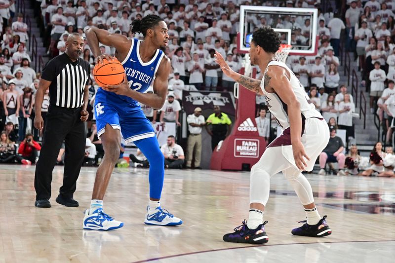 Feb 15, 2023; Starkville, Mississippi, USA; Kentucky Wildcats guard Antonio Reeves (12) handles the ball while defended by Mississippi State Bulldogs guard Shakeel Moore (3) during the second half at Humphrey Coliseum. Mandatory Credit: Matt Bush-USA TODAY Sports