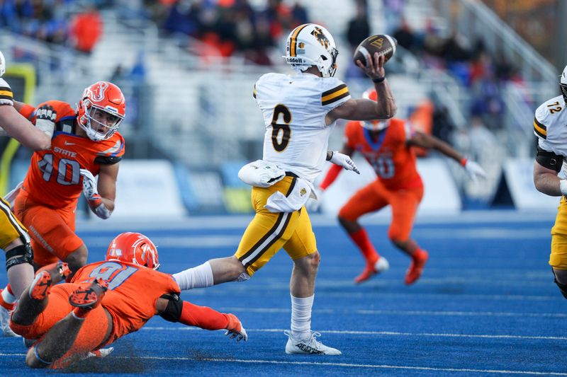 Oct 28, 2023; Boise, Idaho, USA; Wyoming Cowboys quarterback Andrew Peasley (6) throws down field during the second half against the Boise State Broncos at Albertsons Stadium. Mandatory Credit: Brian Losness-USA TODAY Sports