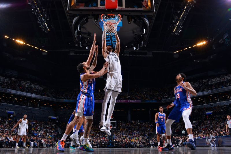 BROOKLYN, NY - MARCH 5: Nicolas Claxton #33 of the Brooklyn Nets dunks the ball during the game against the Philadelphia 76ers on March 5, 2024 at Barclays Center in Brooklyn, New York. NOTE TO USER: User expressly acknowledges and agrees that, by downloading and or using this Photograph, user is consenting to the terms and conditions of the Getty Images License Agreement. Mandatory Copyright Notice: Copyright 2024 NBAE (Photo by Jesse D. Garrabrant/NBAE via Getty Images)