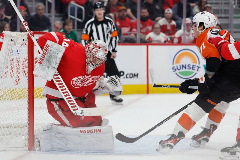 Jan 25, 2024; Detroit, Michigan, USA;  Detroit Red Wings goaltender Alex Lyon (34) makes a save on Philadelphia Flyers right wing Tyson Foerster (71) in the first period at Little Caesars Arena. Mandatory Credit: Rick Osentoski-USA TODAY Sports