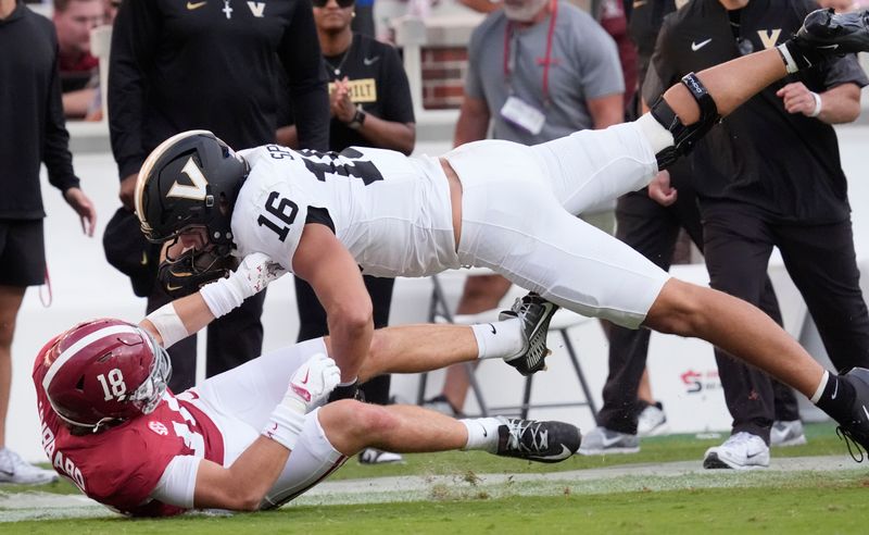 Oct 4, 2025; Tuscaloosa, Alabama, USA;  Alabama defensive back Bray Hubbard (18) makes the tackle on Vanderbilt tight end Cole Spence (16) at Saban Field at Bryant-Denny Stadium. Alabama downed Vanderbilt 30-14. Mandatory Credit: Gary Cosby Jr.-Imagn Images