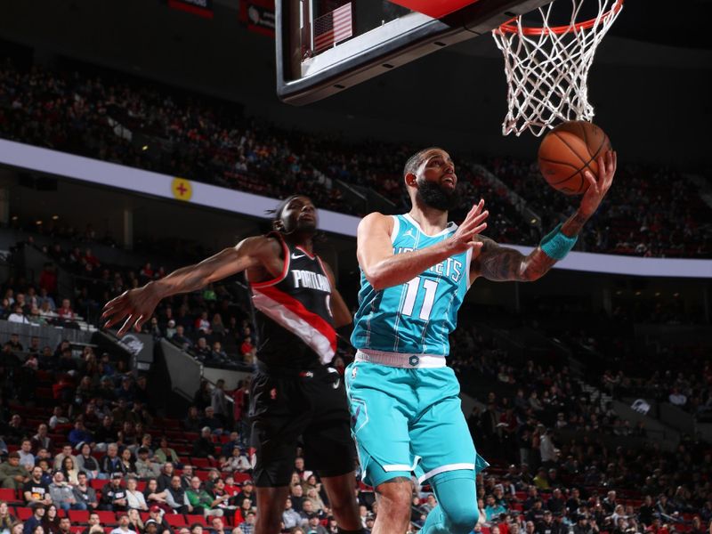 PORTLAND, OR - FEBRUARY 25:  Cody Martin #11 of the Charlotte Hornets goes to the basket during the game on February 25, 2024 at the Moda Center Arena in Portland, Oregon. NOTE TO USER: User expressly acknowledges and agrees that, by downloading and or using this photograph, user is consenting to the terms and conditions of the Getty Images License Agreement. Mandatory Copyright Notice: Copyright 2024 NBAE (Photo by Cameron Browne/NBAE via Getty Images)