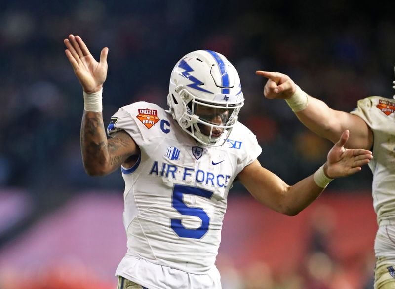 Dec 27, 2019; Phoenix, Arizona, USA; Air Force Falcons quarterback Donald Hammond III (5) celebrates a touchdown against the Washington State Cougars during the second half of the Cheez-It Bowl at Chase Field. Mandatory Credit: Mark J. Rebilas-USA TODAY Sports