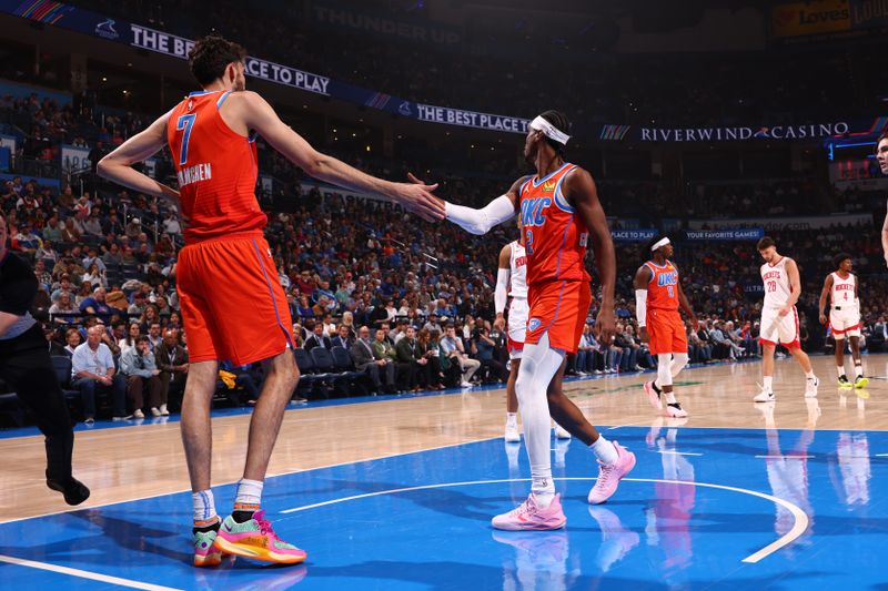 OKLAHOMA CITY, OK - FEBRUARY 27: Chet Holmgren #7 and Shai Gilgeous-Alexander #2 of the Oklahoma City Thunder high five during the game against the Houston Rockets on February, 2024 at Paycom Arena in Oklahoma City, Oklahoma. NOTE TO USER: User expressly acknowledges and agrees that, by downloading and or using this photograph, User is consenting to the terms and conditions of the Getty Images License Agreement. Mandatory Copyright Notice: Copyright 2024 NBAE (Photo by Zach Beeker/NBAE via Getty Images)