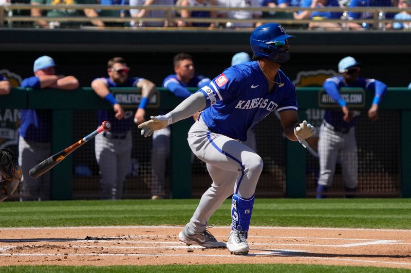 Mar 10, 2024; Mesa, Arizona, USA; Kansas City Royals right fielder MJ Melendez (1) hits a single against the Oakland Athletics in the first inning at Hohokam Stadium. Mandatory Credit: Rick Scuteri-USA TODAY Sports