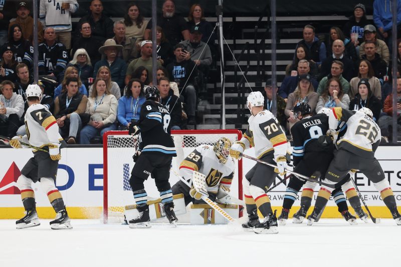 Nov 15, 2024; Salt Lake City, Utah, USA; Vegas Golden Knights goaltender Adin Hill (33) blocks a shot by Utah Hockey Club center Clayton Keller (9) during the first period at Delta Center. Mandatory Credit: Rob Gray-Imagn Images