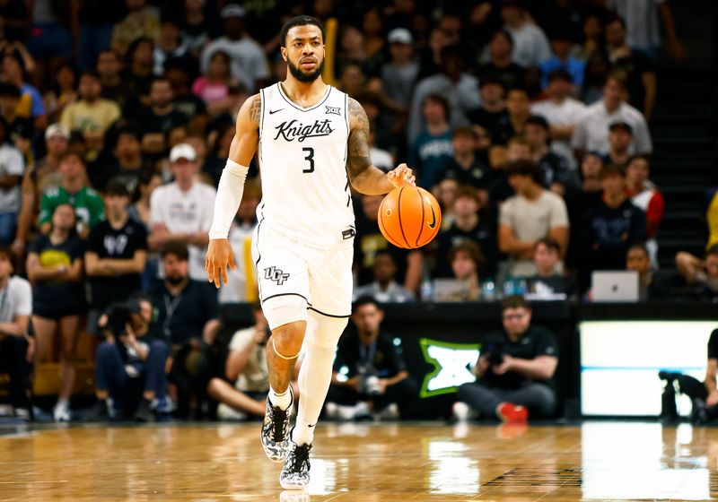 Feb 11, 2025; Orlando, Florida, USA;  Central Florida Knights guard Darius Johnson (3) dibbles the ball up the court against the Iowa State Cyclones at Addition Financial Arena. Mandatory Credit: Russell Lansford-Imagn Images