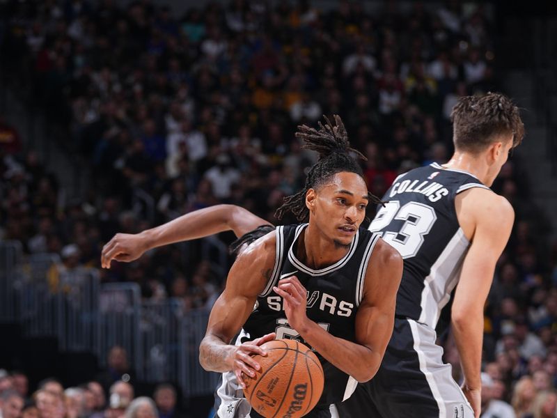 DENVER, CO - JANUARY 3:  Devin Vassell #24 of the San Antonio Spurs dribbles the ball during the game against the Denver Nuggets on January 3, 2025 at Ball Arena in Denver, Colorado. NOTE TO USER: User expressly acknowledges and agrees that, by downloading and/or using this Photograph, user is consenting to the terms and conditions of the Getty Images License Agreement. Mandatory Copyright Notice: Copyright 2025 NBAE (Photo by Bart Young/NBAE via Getty Images)