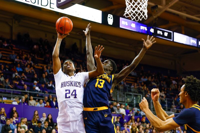 Jan 14, 2023; Seattle, Washington, USA; Washington Huskies guard Noah Williams (24) makes a layup against California Golden Bears forward Kuany Kuany (13) during overtime at Alaska Airlines Arena at Hec Edmundson Pavilion. Mandatory Credit: Joe Nicholson-USA TODAY Sports