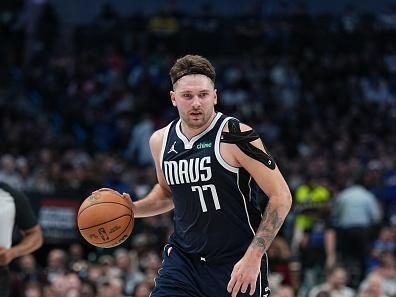 DALLAS, TX - DECEMBER 23: Luka Doncic #77 of the Dallas Mavericks dribbles the ball during the game against the San Antonio Spurs on December 23, 2023 at the American Airlines Center in Dallas, Texas. NOTE TO USER: User expressly acknowledges and agrees that, by downloading and or using this photograph, User is consenting to the terms and conditions of the Getty Images License Agreement. Mandatory Copyright Notice: Copyright 2023 NBAE (Photo by Glenn James/NBAE via Getty Images)