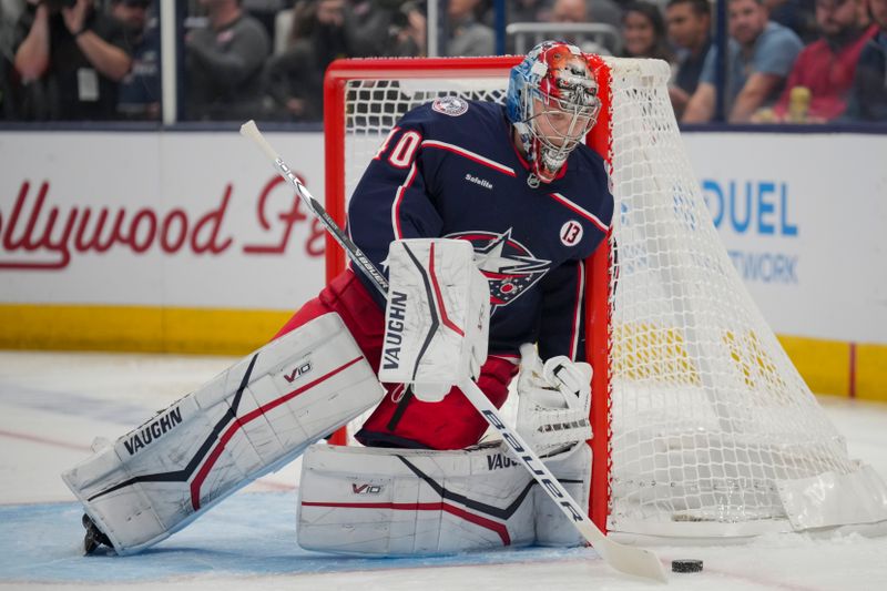 Oct 22, 2024; Columbus, Ohio, USA; Columbus Blue Jackets goaltender Daniil Tarasov (40) controls the puck during the first period at Nationwide Arena. Mandatory Credit: Aaron Doster-Imagn Images