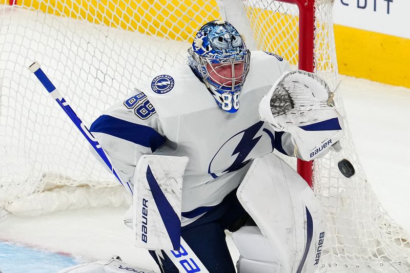 Mar 19, 2024; Las Vegas, Nevada, USA; Tampa Bay Lightning goaltender Andrei Vasilevskiy (88) makes a glove save against Vegas Golden Knights right wing Keegan Kolesar (55) during the third period at T-Mobile Arena. Mandatory Credit: Stephen R. Sylvanie-USA TODAY Sports