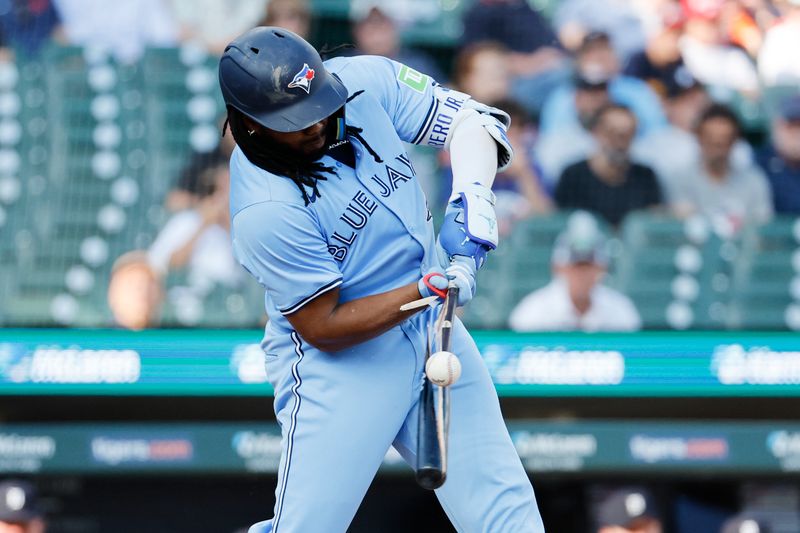 May 23, 2024; Detroit, Michigan, USA;  Toronto Blue Jays first baseman Vladimir Guerrero Jr. (27) breaks his bat grounding out in the first inning against the Detroit Tigers at Comerica Park. Mandatory Credit: Rick Osentoski-USA TODAY Sports