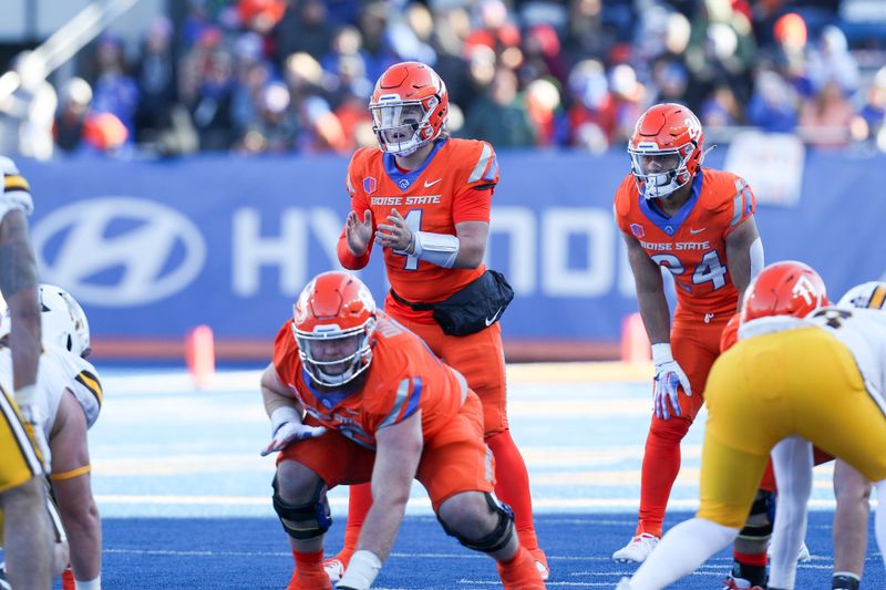 Oct 28, 2023; Boise, Idaho, USA; Boise State Broncos quarterback Maddux Madsen (4) gestures during the first half against the against the Wyoming Cowboys at Albertsons Stadium. Mandatory Credit: Brian Losness-USA TODAY Sports