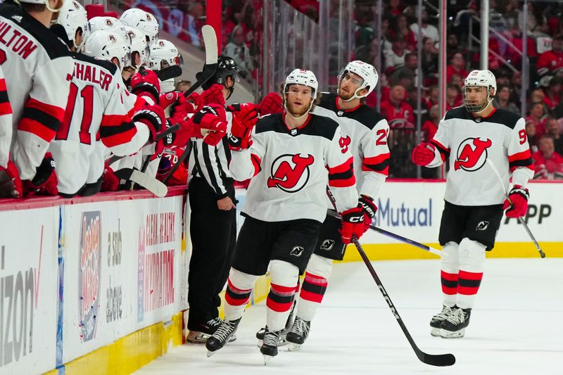 May 11, 2023; Raleigh, North Carolina, USA; New Jersey Devils center Dawson Mercer (91) celebrates his goal against the Carolina Hurricanes during the first period in game five of the second round of the 2023 Stanley Cup Playoffs at PNC Arena. Mandatory Credit: James Guillory-USA TODAY Sports