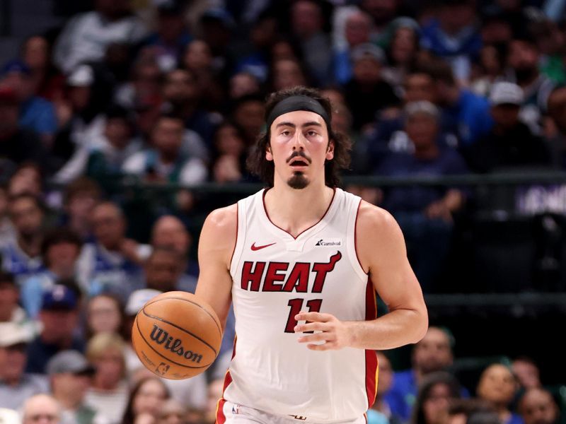 DALLAS, TEXAS - MARCH 07: Jaime Jaquez Jr. #11 of the Miami Heat dribbles the ball up court in the first half against the Dallas Mavericks at American Airlines Center on March 07, 2024 in Dallas, Texas.  NOTE TO USER: User expressly acknowledges and agrees that, by downloading and or using this photograph, User is consenting to the terms and conditions of the Getty Images License Agreement. (Photo by Tim Heitman/Getty Images)