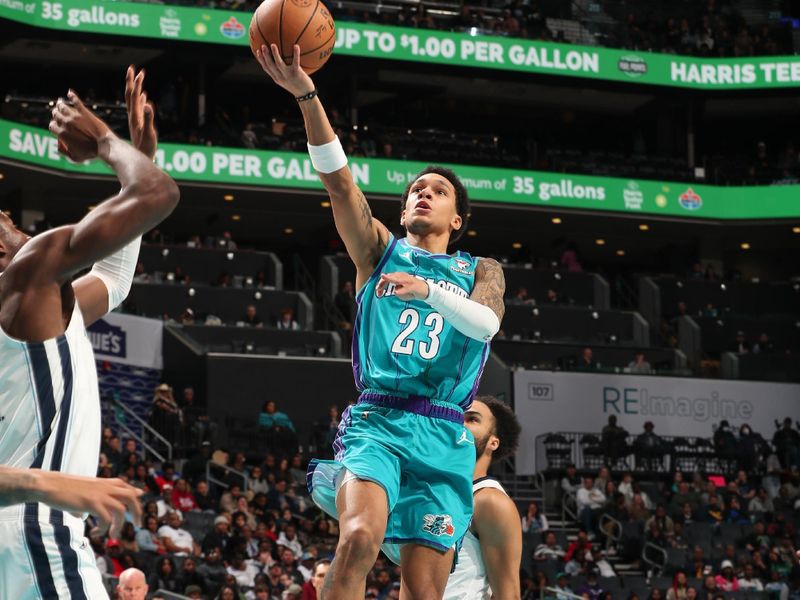 CHARLOTTE, NC - FEBRUARY 10:  Tre Mann #23 of the  Charlotte Hornets goes to the basket during the game on February 10, 2024 at Spectrum Center in Charlotte, North Carolina. NOTE TO USER: User expressly acknowledges and agrees that, by downloading and or using this photograph, User is consenting to the terms and conditions of the Getty Images License Agreement.  Mandatory Copyright Notice:  Copyright 2024 NBAE (Photo by Kent Smith/NBAE via Getty Images)