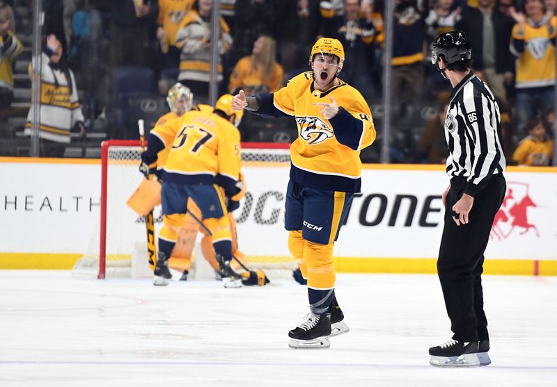 Jan 21, 2023; Nashville, Tennessee, USA; Nashville Predators left wing Tanner Jeannot (84) tries to get the crowd going after a fight against Los Angeles Kings left wing Brendan Lemieux (not pictured) during the first period at Bridgestone Arena. Mandatory Credit: Christopher Hanewinckel-USA TODAY Sports