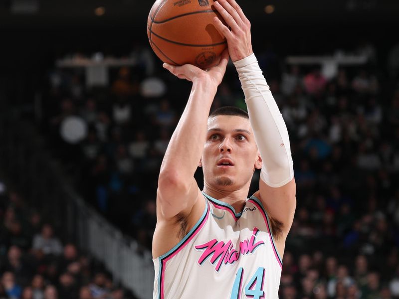 MILWAUKEE, WI - FEBRUARY 23:  Tyler Herro #14 of the Miami Heat shoots a free throw during the game against the Milwaukee Bucks on February 23, 2025 at Fiserv Forum Center in Milwaukee, Wisconsin. NOTE TO USER: User expressly acknowledges and agrees that, by downloading and or using this Photograph, user is consenting to the terms and conditions of the Getty Images License Agreement. Mandatory Copyright Notice: Copyright 2025 NBAE (Photo by Gary Dineen/NBAE via Getty Images).