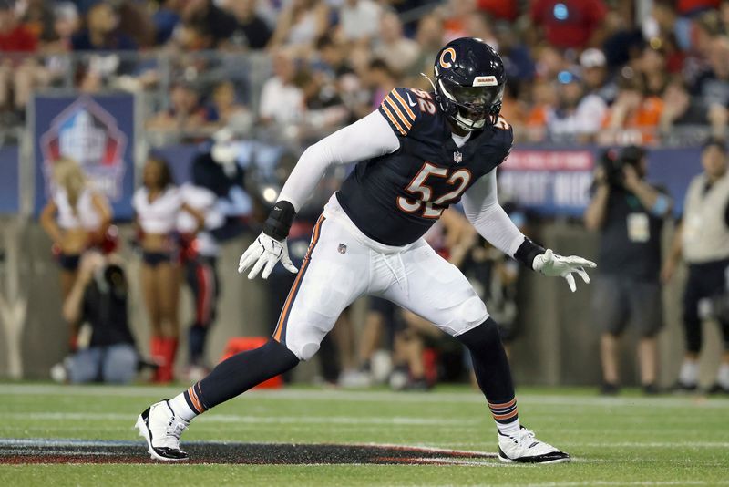 Chicago Bears defensive end Khalid Kareem (52) runs after the ball during an NFL preseason football game against the Houston Texans, Thursday Aug. 21, 2024, in Canton, Ohio. (AP Photo/Kirk Irwin)