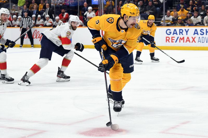 Jan 22, 2024; Nashville, Tennessee, USA; Nashville Predators left wing Filip Forsberg (9) handles the puck in the offensive zone during the first period against the Florida Panthers at Bridgestone Arena. Mandatory Credit: Christopher Hanewinckel-USA TODAY Sports