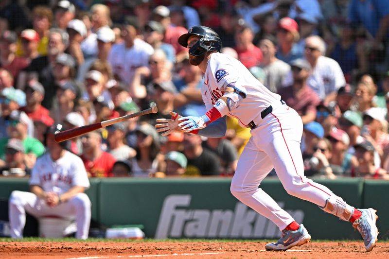 Jul 13, 2025; Boston, Massachusetts, USA; Boston Red Sox shortstop Trevor Story (10) hits a RBI single against the Tampa Bay Rays during the sixth inning  at Fenway Park. Mandatory Credit: Brian Fluharty-Imagn Images