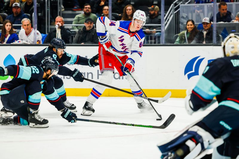 Nov 17, 2024; Seattle, Washington, USA; New York Rangers center Adam Edstrom (84) skates with the puck against the Seattle Kraken during the second period at Climate Pledge Arena. Mandatory Credit: Joe Nicholson-Imagn Images
