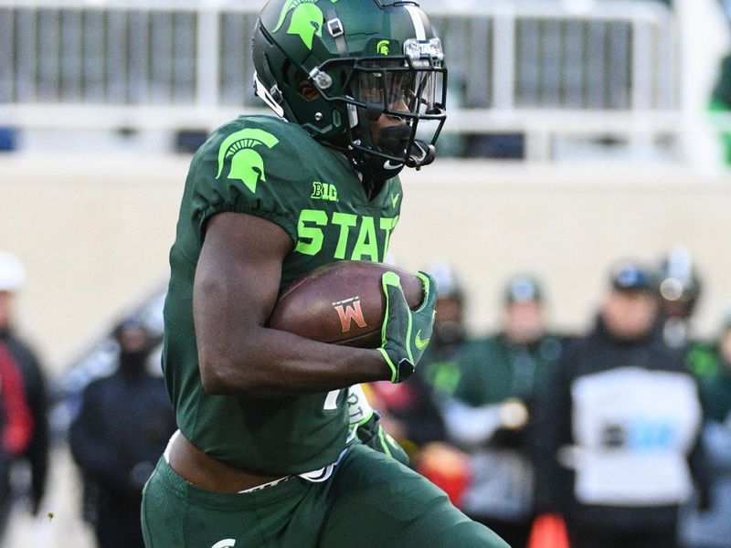 Nov 13, 2021; East Lansing, Michigan, USA; Michigan State Spartans wide receiver Jayden Reed (1) runs the ball during the first quarter against the Maryland Terrapins at Spartan Stadium. Mandatory Credit: Tim Fuller-USA TODAY Sports