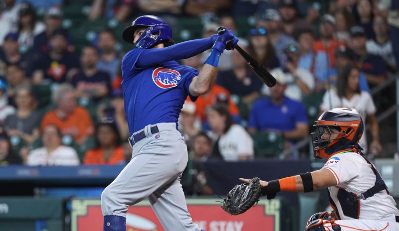May 17, 2023; Houston, Texas, USA; Chicago Cubs shortstop Dansby Swanson (7) hits a triple during the first inning against the Houston Astros at Minute Maid Park. Mandatory Credit: Troy Taormina-USA TODAY Sports