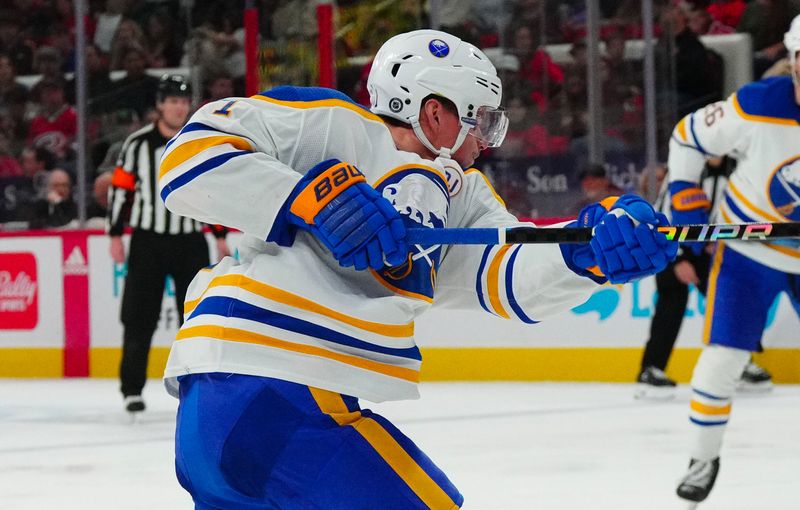 Dec 2, 2023; Raleigh, North Carolina, USA; Buffalo Sabres left wing Victor Olofsson (71) takes a shot against the Carolina Hurricanes during the second period at PNC Arena. Mandatory Credit: James Guillory-USA TODAY Sports