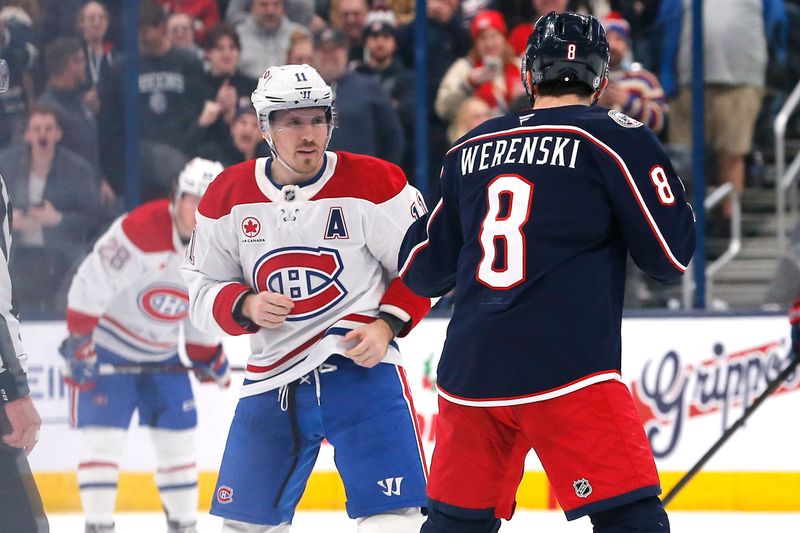 Nov 27, 2024; Columbus, Ohio, USA; Columbus Blue Jackets defenseman Zach Werenski (8) and Montreal Canadiens right wing Brendan Gallagher (11) fight during the second period at Nationwide Arena. Mandatory Credit: Russell LaBounty-Imagn Images