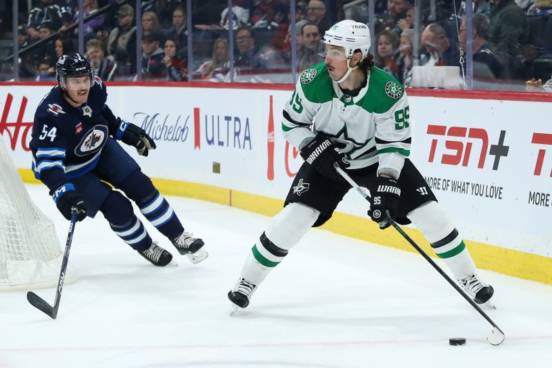 Nov 11, 2023; Winnipeg, Manitoba, CAN;  Dallas Stars forward Matt Duchene (95) looks to make a pass by Winnipeg Jets defenseman Dylan Samberg (54) during the first period at Canada Life Centre. Mandatory Credit: Terrence Lee-USA TODAY Sports