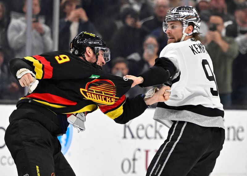 Apr 10, 2023; Los Angeles, California, USA;  Vancouver Canucks center J.T. Miller (9) and Los Angeles Kings right wing Adrian Kempe (9) fight in the second period at Crypto.com Arena. Mandatory Credit: Jayne Kamin-Oncea-USA TODAY Sports