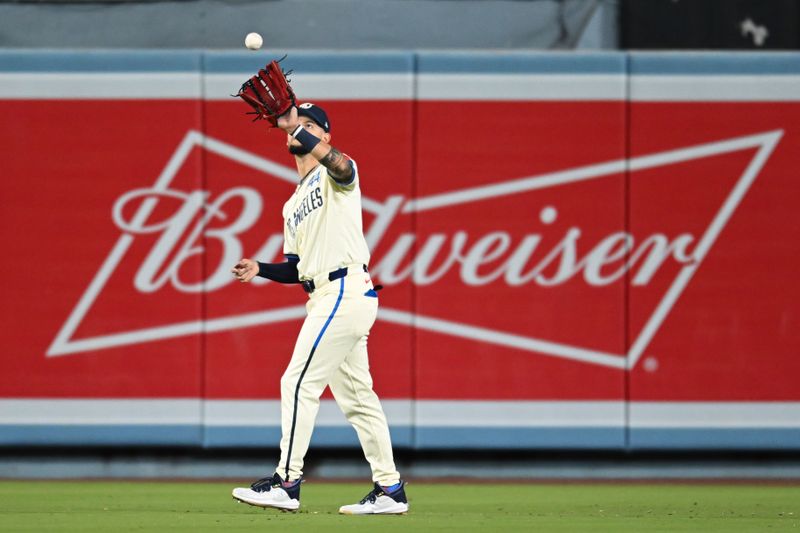 Jun 22, 2024; Los Angeles, California, USA; Los Angeles Dodgers outfielder Andy Pages (44) makes a catch against the Los Angeles Angels during the eighth inning at Dodger Stadium. Mandatory Credit: Jonathan Hui-USA TODAY Sports