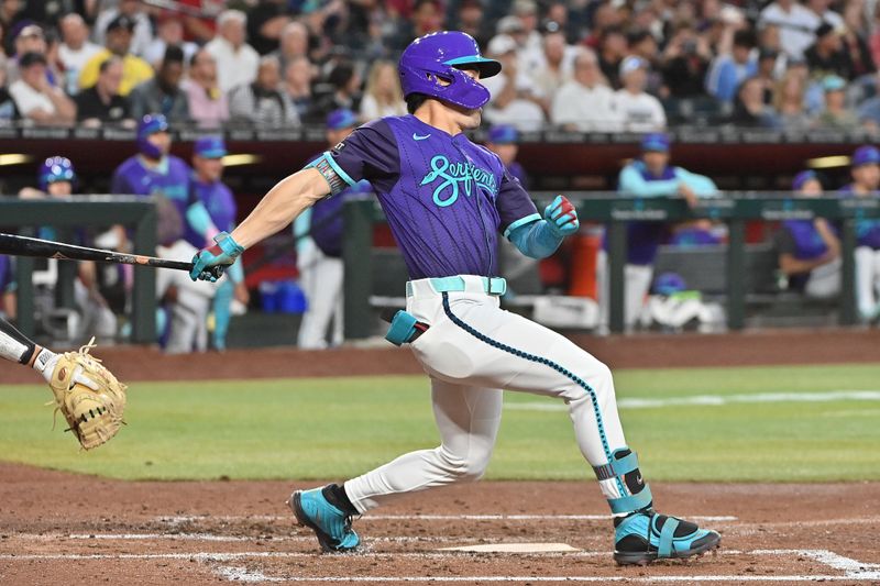 May 16, 2025; Phoenix, Arizona, USA;  Arizona Diamondbacks outfielder Corbin Carroll (7) doubles in the third inning against the Colorado Rockies at Chase Field. Mandatory Credit: Matt Kartozian-Imagn Images