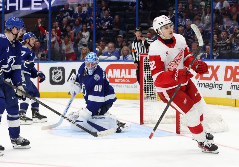 Apr 11, 2025; Tampa, Florida, USA; Detroit Red Wings right wing Alex DeBrincat (93) shoots and scores the game winning goal against the Tampa Bay Lightning during overtime at Amalie Arena. Mandatory Credit: Kim Klement Neitzel-Imagn Images