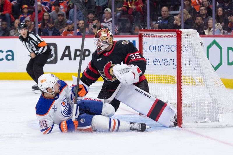 Oct 21, 2025; Ottawa, Ontario, CAN; Edmonton Oilers left wing Andrew Mangiapane (88) slides into Ottawa Senators goalie Linus Ullmark (35) in the second period at the Canadian Tire Centre. Mandatory Credit: Marc DesRosiers-IMAGN Images