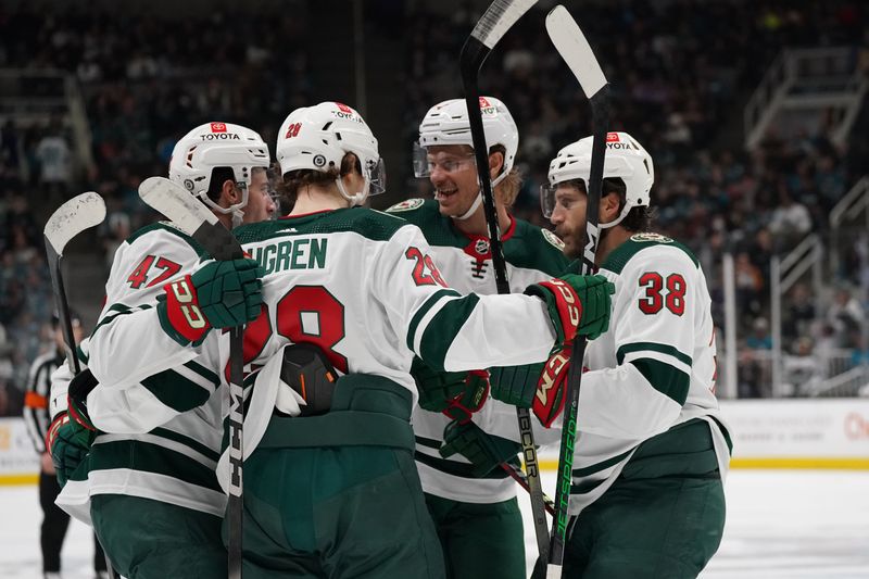 Apr 13, 2024; San Jose, California, USA; Minnesota Wild defenseman Declan Chisholm (47) is congratulated by teammates after scoring a goal during the first period at SAP Center at San Jose. Mandatory Credit: David Gonzales-USA TODAY Sports