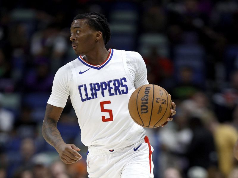 NEW ORLEANS, LOUISIANA - MARCH 15: Bones Hyland #5 of the LA Clippers dribbles the ball down court during first quarter of an NBA game against the New Orleans Pelicans at Smoothie King Center on March 15, 2024 in New Orleans, Louisiana. NOTE TO USER: User expressly acknowledges and agrees that, by downloading and or using this photograph, User is consenting to the terms and conditions of the Getty Images License Agreement. (Photo by Sean Gardner/Getty Images)