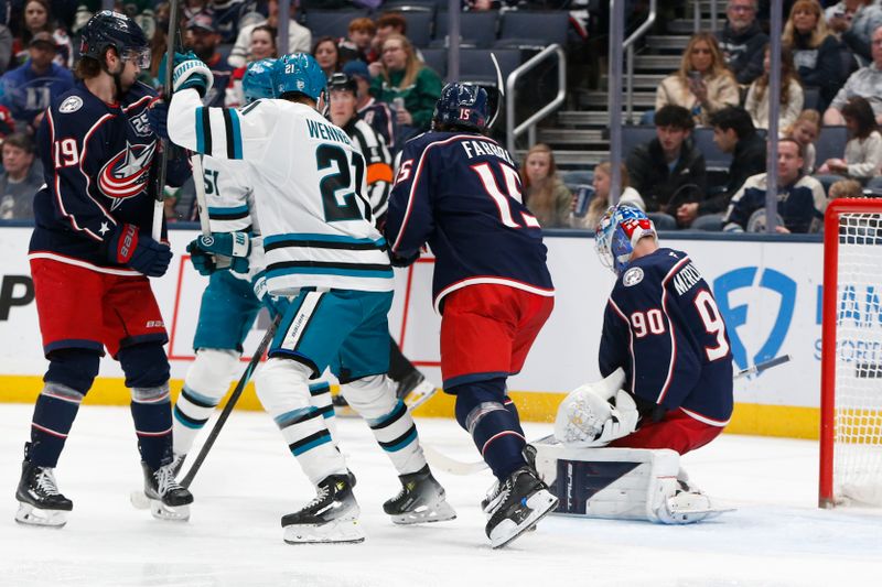 Mar 28, 2026; Columbus, Ohio, USA; Columbus Blue Jackets goalie Elvis Merzlikins (90) makes a save against the San Jose Sharks during the second period at Nationwide Arena. Mandatory Credit: Russell LaBounty-Imagn Images