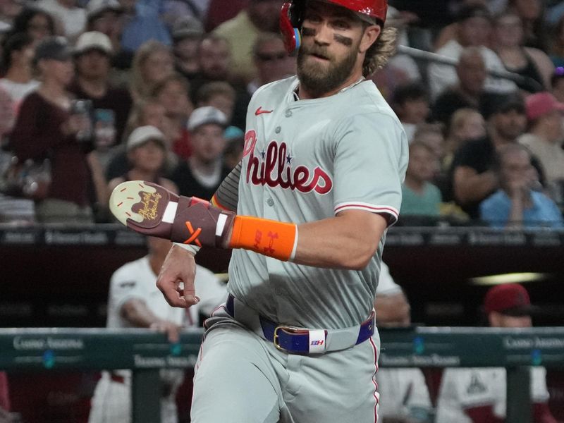 Aug 11, 2024; Phoenix, Arizona, USA; Philadelphia Phillies first base Bryce Harper (3) scores a run against the Arizona Diamondbacks in the first inning at Chase Field. Mandatory Credit: Rick Scuteri-USA TODAY Sports